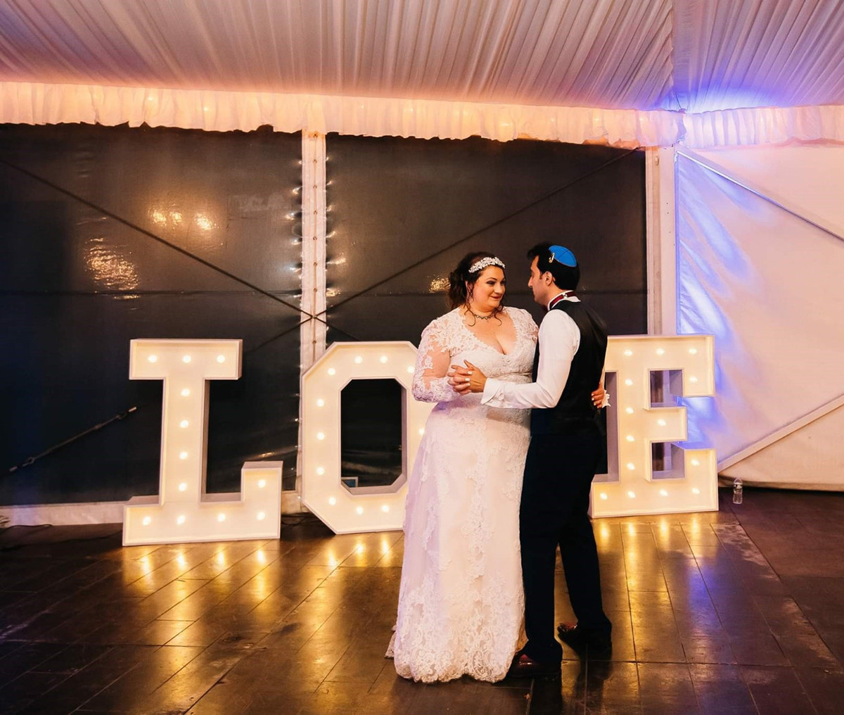 Marquee LOVE letters with couple