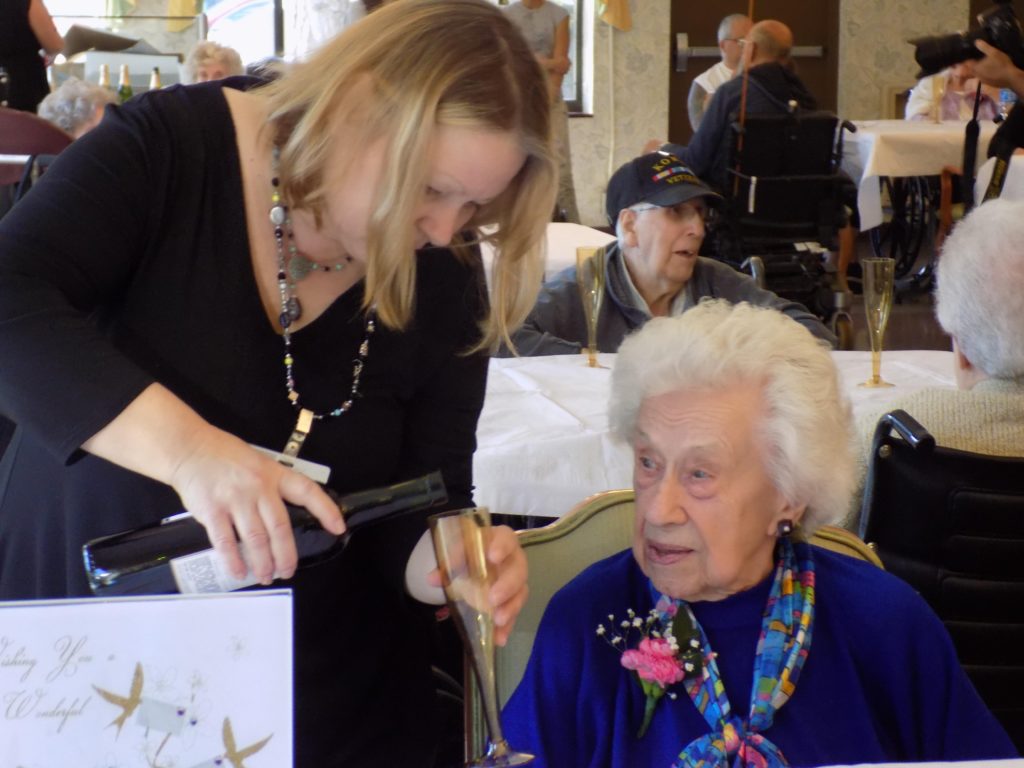 sharon pouring champagnewith Leola M