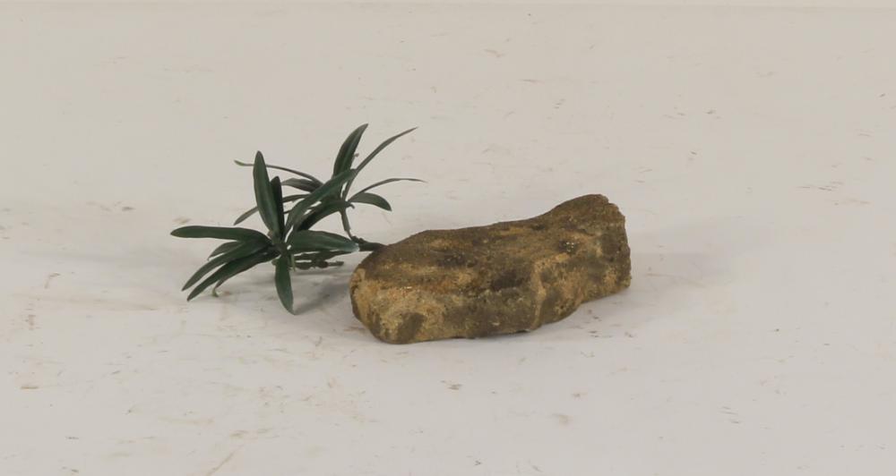artificial rock with faux plant
