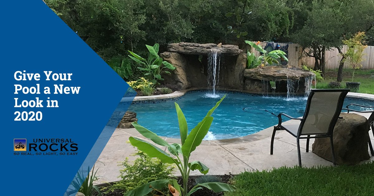faux rock grotto with waterfall in backyard swimming pool