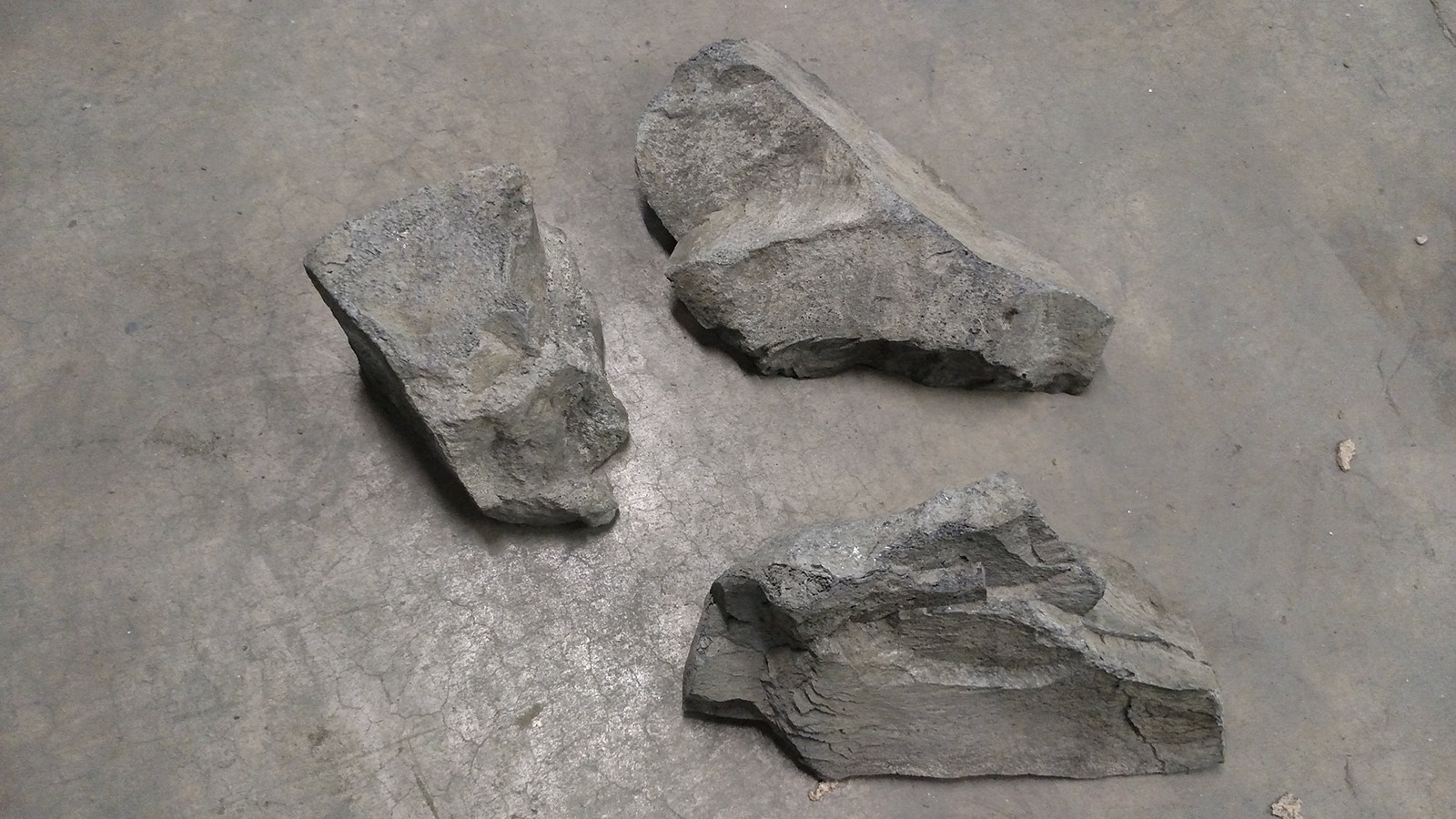gray faux rocks on cement floor