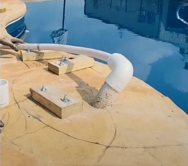 piping for rock waterfall install on swimming pool