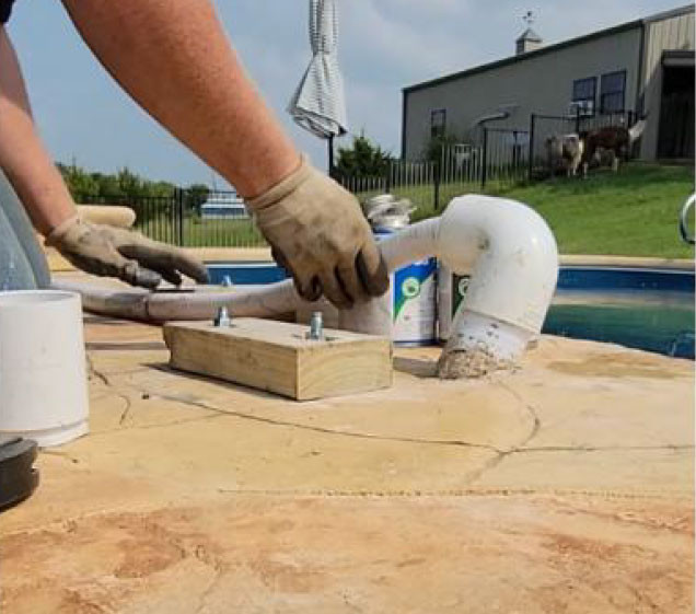 installing pipes for artificial rock waterfall swimming pool