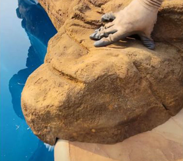 faux rock waterfall overhang on swimming pool