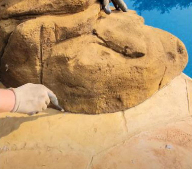 outlining concrete for artificial rock waterfall swimming pool install