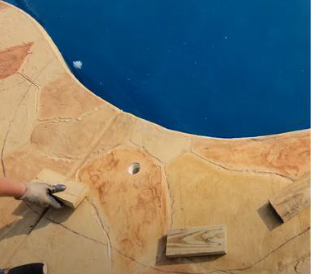 blocks on conrete for rock waterfall pool install