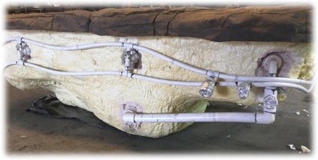 faux rock hot tub spa exterior plumbing