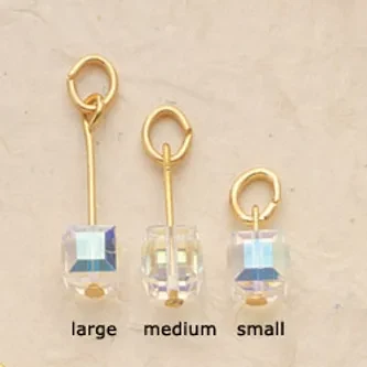 Aurora Borealis Cube Charms $28. (Priced per pair)