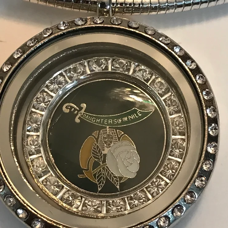 Daughters of the Nile Crystal Locket ( The locket opens and has a glass window)