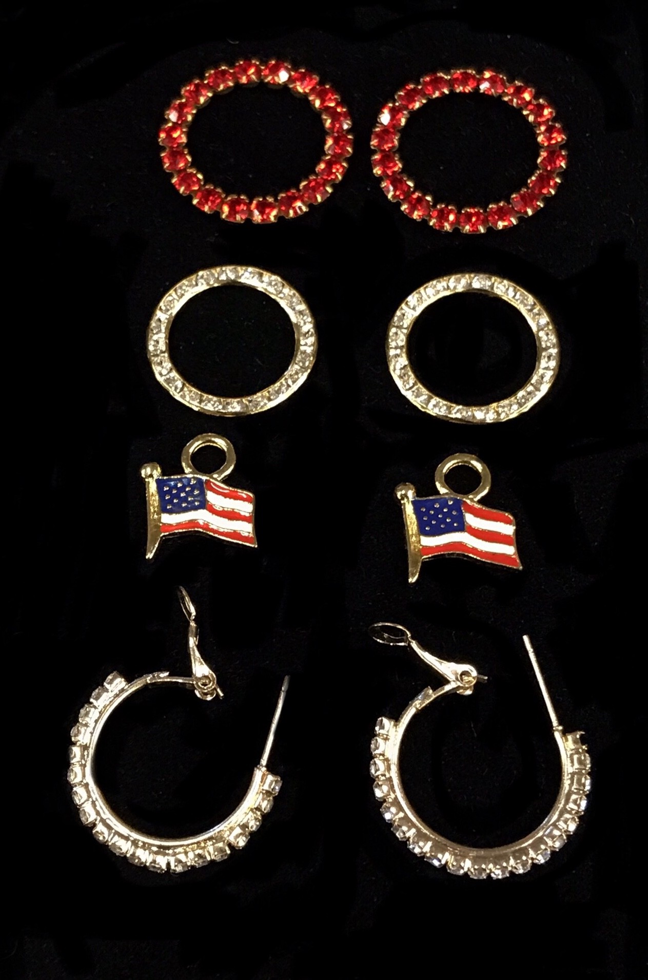 Flag set with crystal hoops and large crystal rings $72