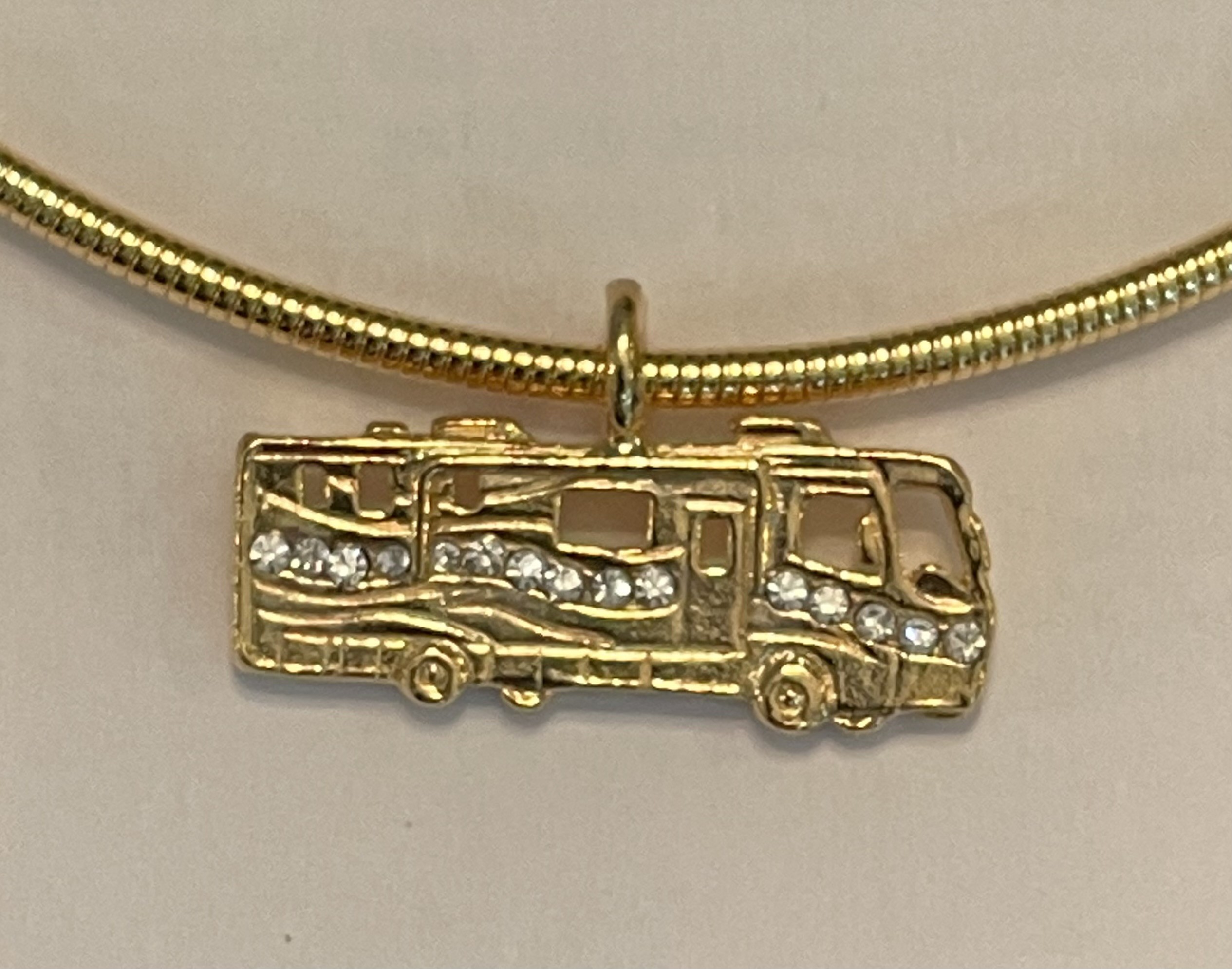 Motor Coach pendant with crystal  $39.95. (Pendant only)