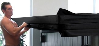 man opening swim spa cover