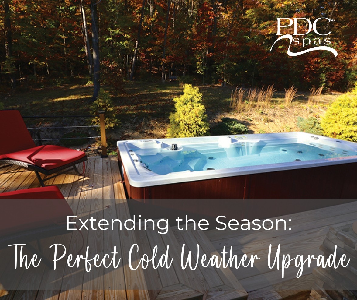 PDC Spas swim spa in fall surrounded by decking with patio chairs