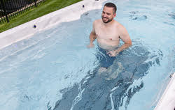 man running in swim spa on non-slip mat