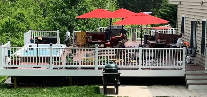 pdc spas splash series baja on deck with patio furniture and outdoor umbrella