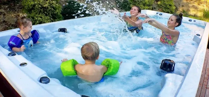 kids splashing in pdc spas splash baja pool alternative