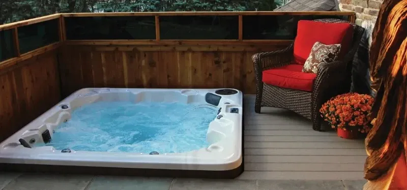 pdc spas lifestyle series hot tub in small outdoor deck