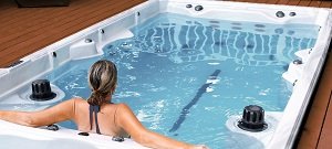woman relaxing in swim spa