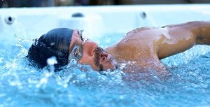 Man swimming in Swim Spa