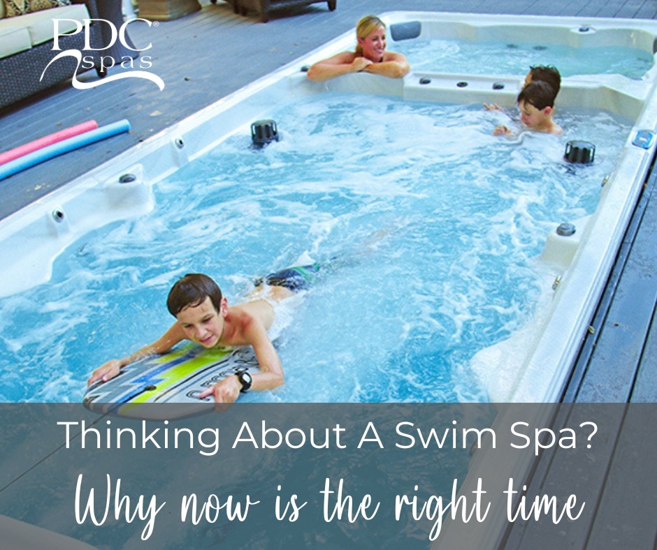 child on a boogie board in a pdc spas swim spa with siblings and mother relaxing in the water