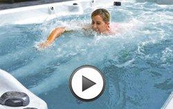 woman swimming in pdc spas synergy swim spa