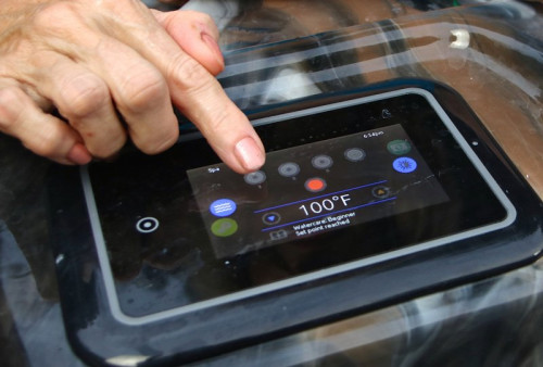 finger adjusting controls of hot tub
