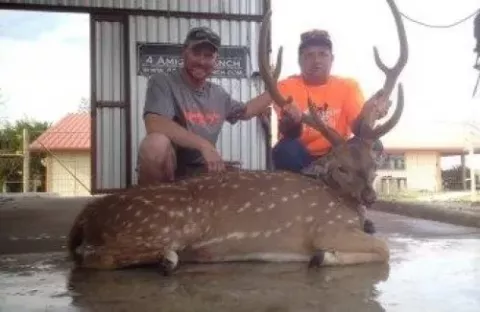 two male hunters with trophy buck
