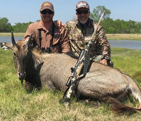two men with nilgai trophy