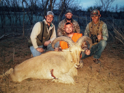 4 men posing with ram trophy