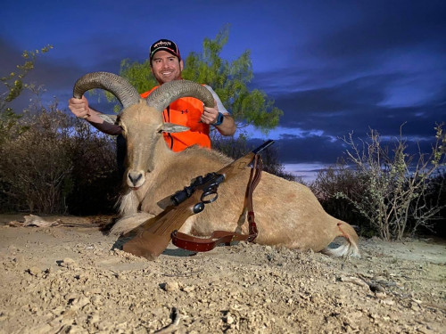 hunter with ram trophy