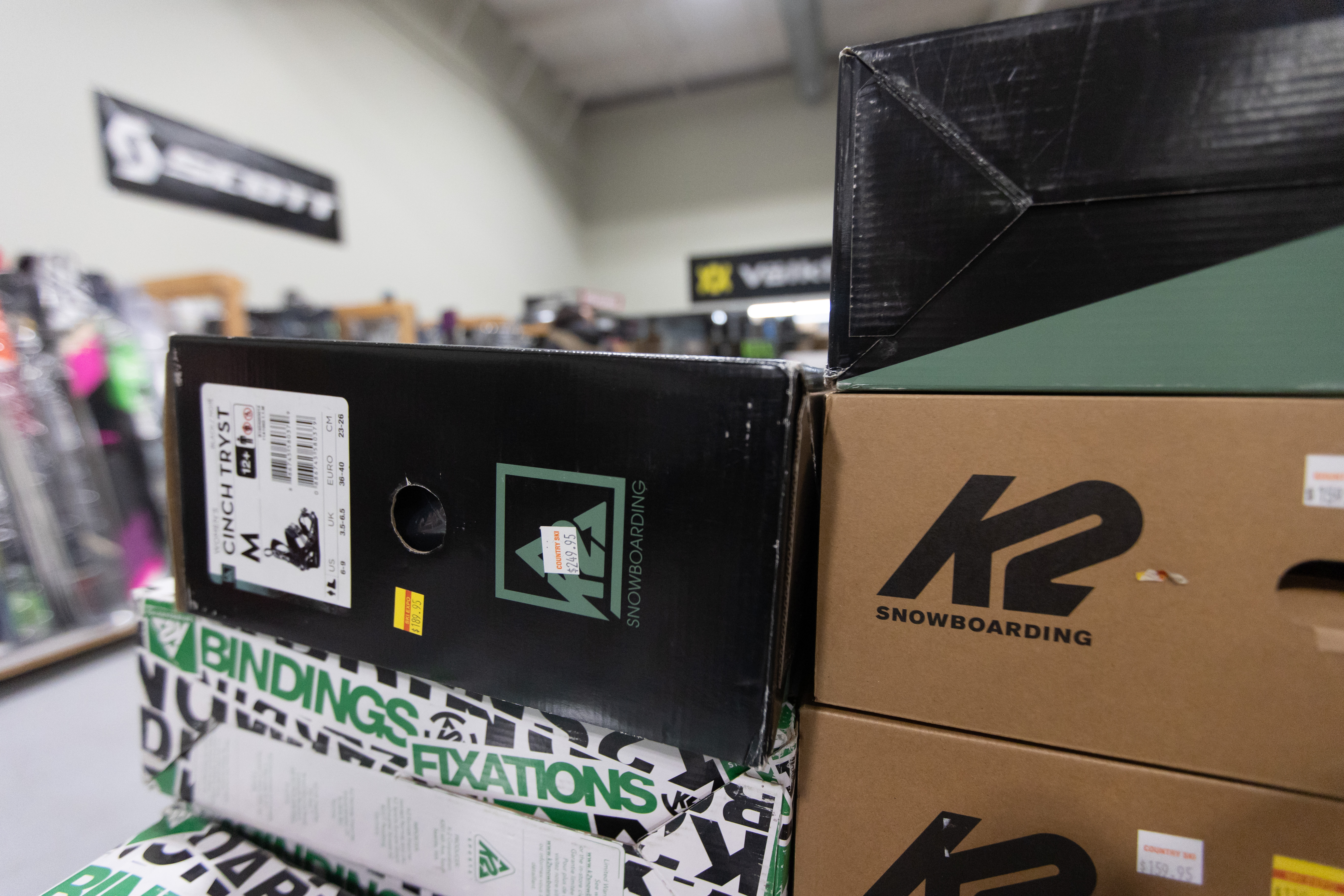 boxes stacked on snowboard bindings