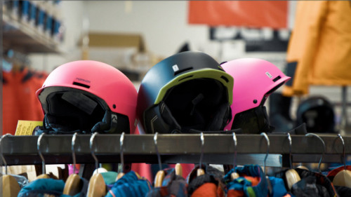 black and pink ski helmets