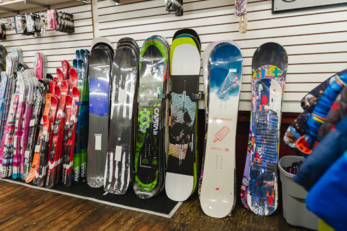 various snowboards in different designs