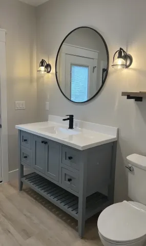 a modern grey bathroom sink with white countertop and black faucet