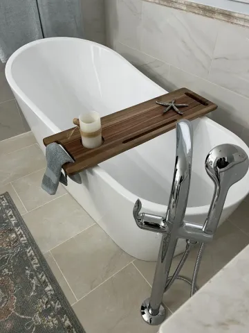A new white bathtub in a modern bathroom