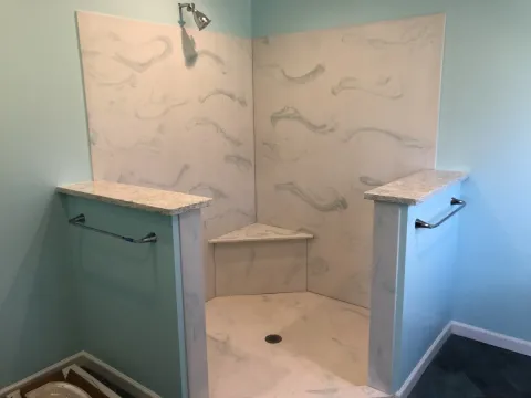 A new shower stall in a refinished bathroom.