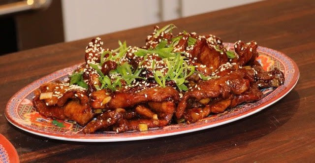 Crispy dry aged Mongolian beef on serving platter