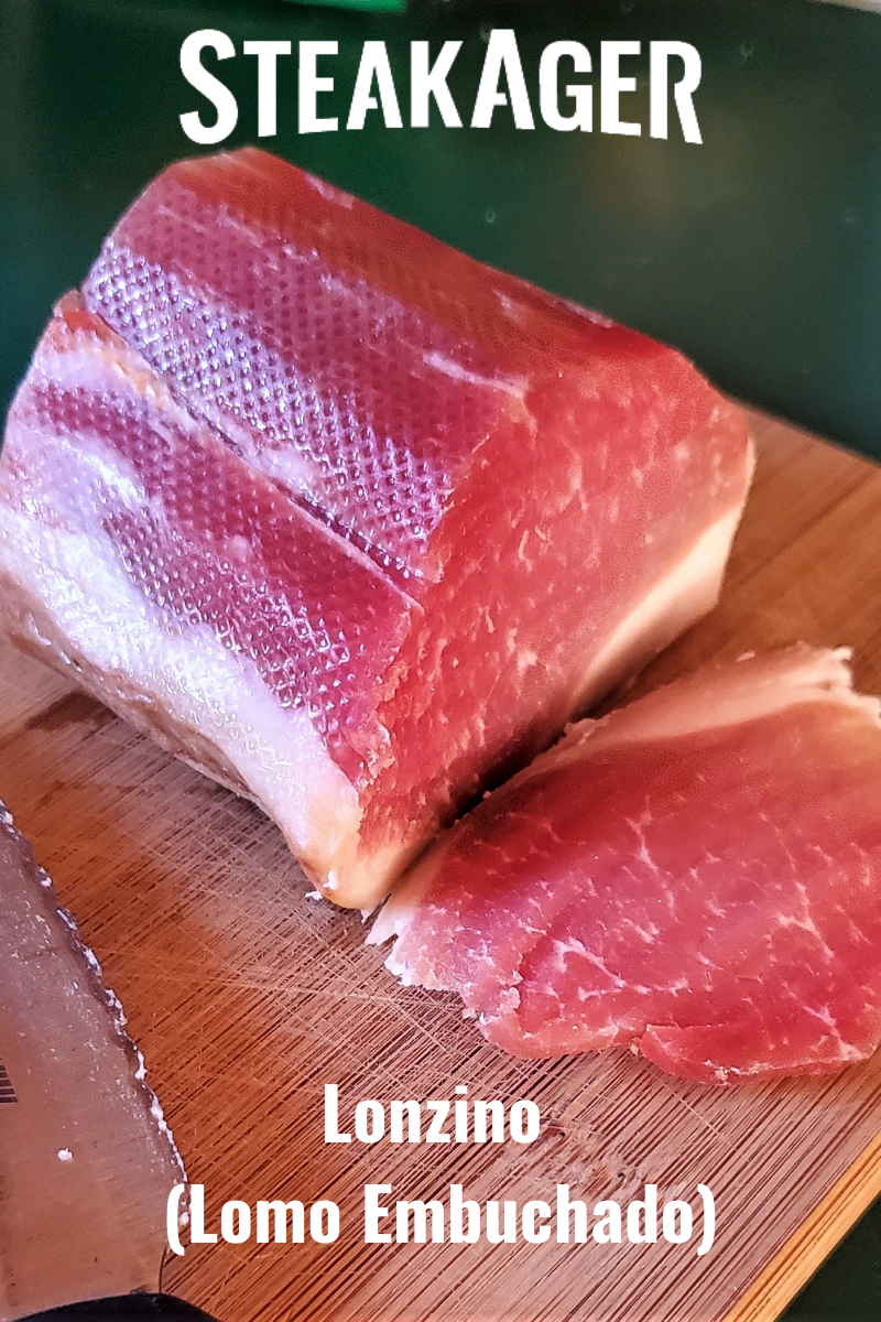 Pork loin on cutting board with knife