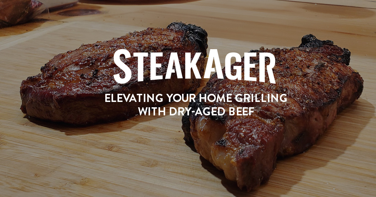 two grilled steaks on a bamboo cutting board
