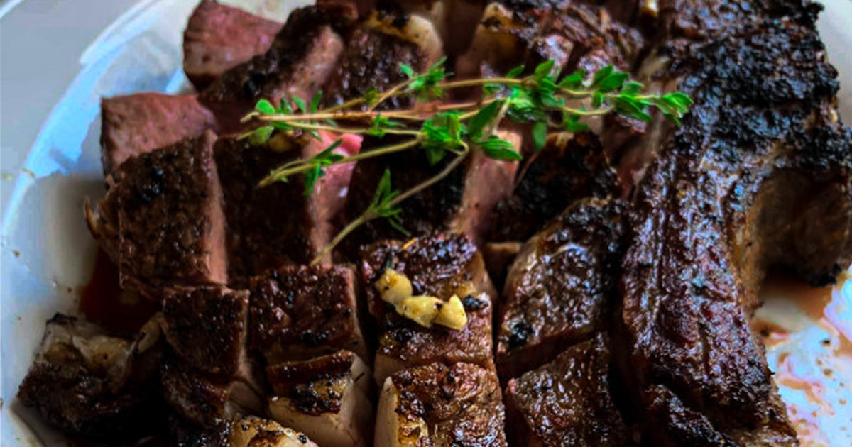 chopped grilled steak topped with thyme