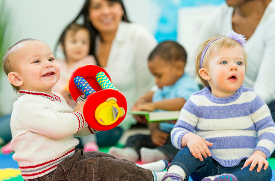 Teachers engaging with infants at Storybook Academy
