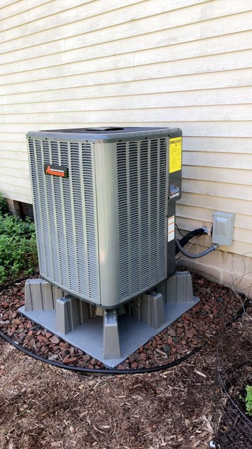 Exterior residential heat pump in Webster NY