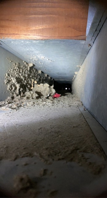 dirty air duct being inspected by av enterprise heating and cooling