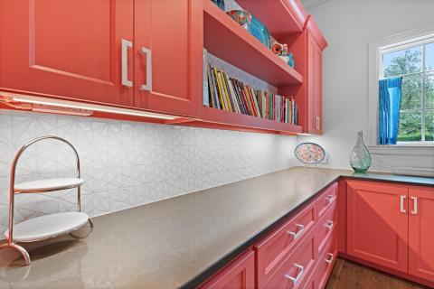white kitchen backsplash with red cabinets
