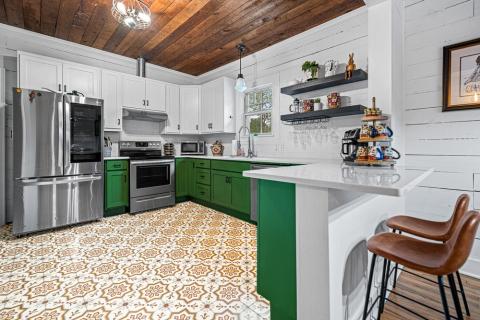 yellow tile floor green cabinets