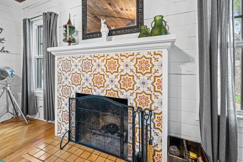orange and yellow patterned fireplace tile