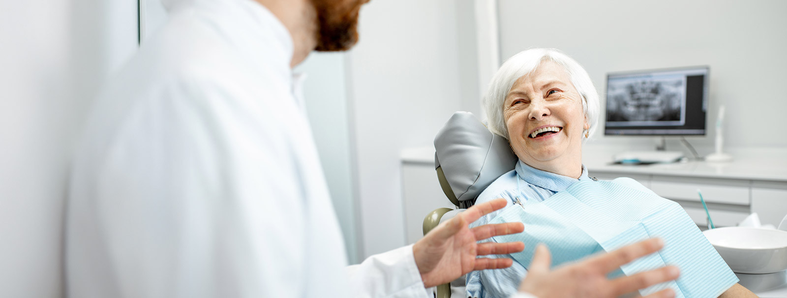 dentist talking to woman
