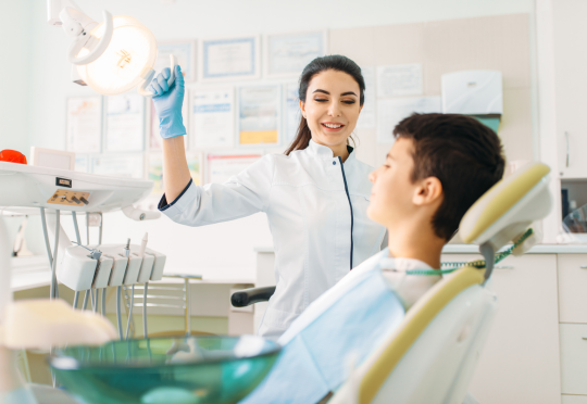 young boy being seen for a dental emergency at canandaigua smiles