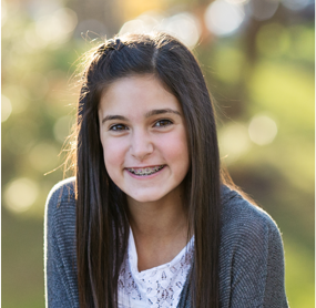 adolescent girl smiling with braces