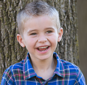 young boy with a big smile